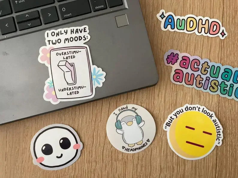 Overstimulated vs understimulated vinyl sticker shown as laptop sticker, handmade by Neurodiversetea