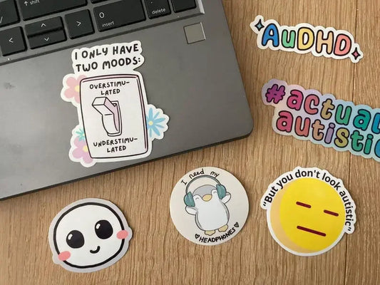 Overstimulated vs understimulated vinyl sticker shown as laptop sticker, handmade by Neurodiversetea
