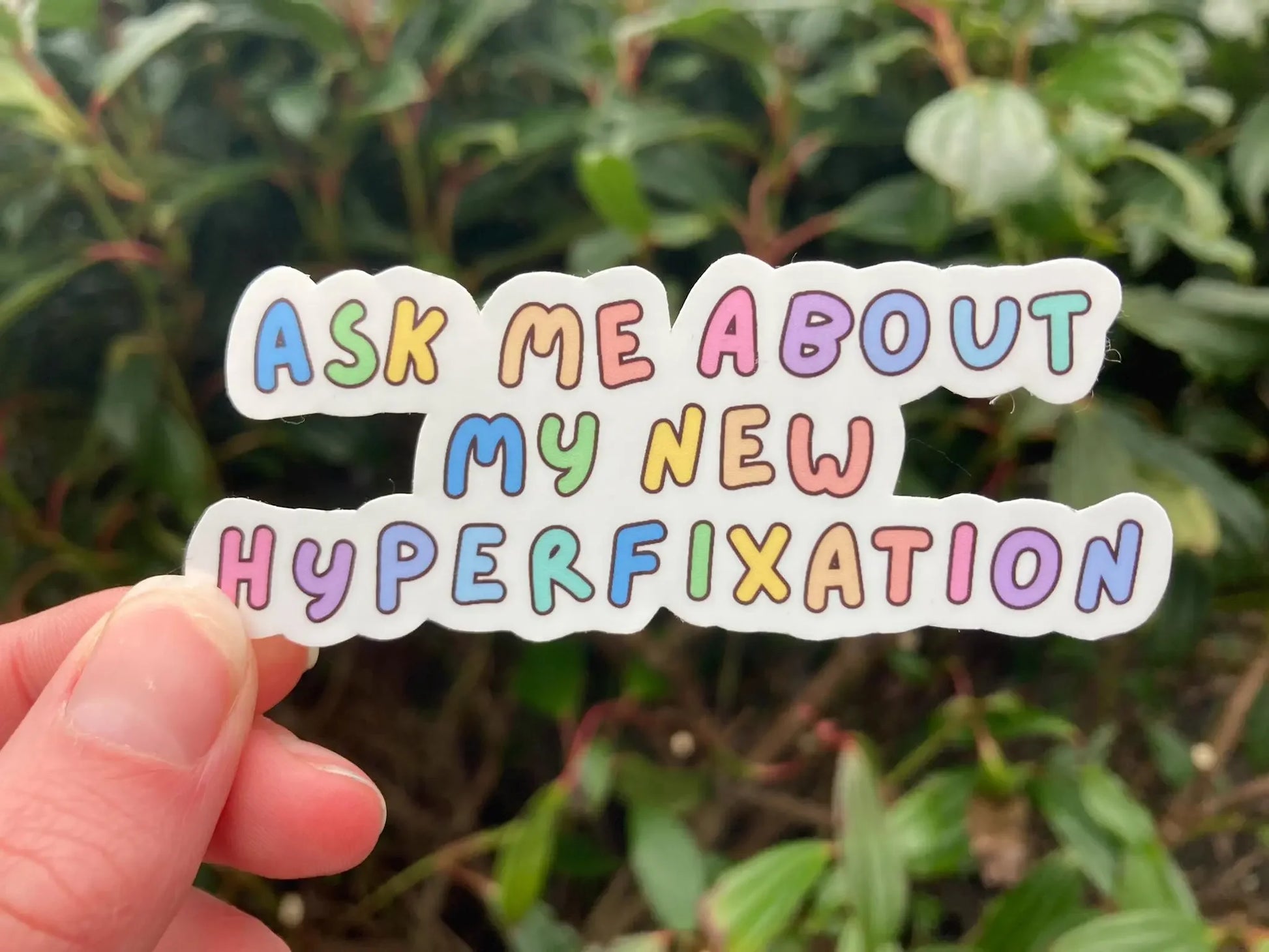 "Ask me about my new hyperfixation" rainbow font ADHD sticker, handmade by Neurodiversetea
