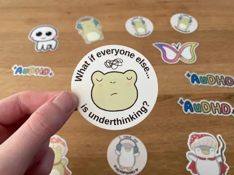 Cute frog overthinker stickers with the text "What if everyone else is underthinking", handmade by NeurodiverseTea