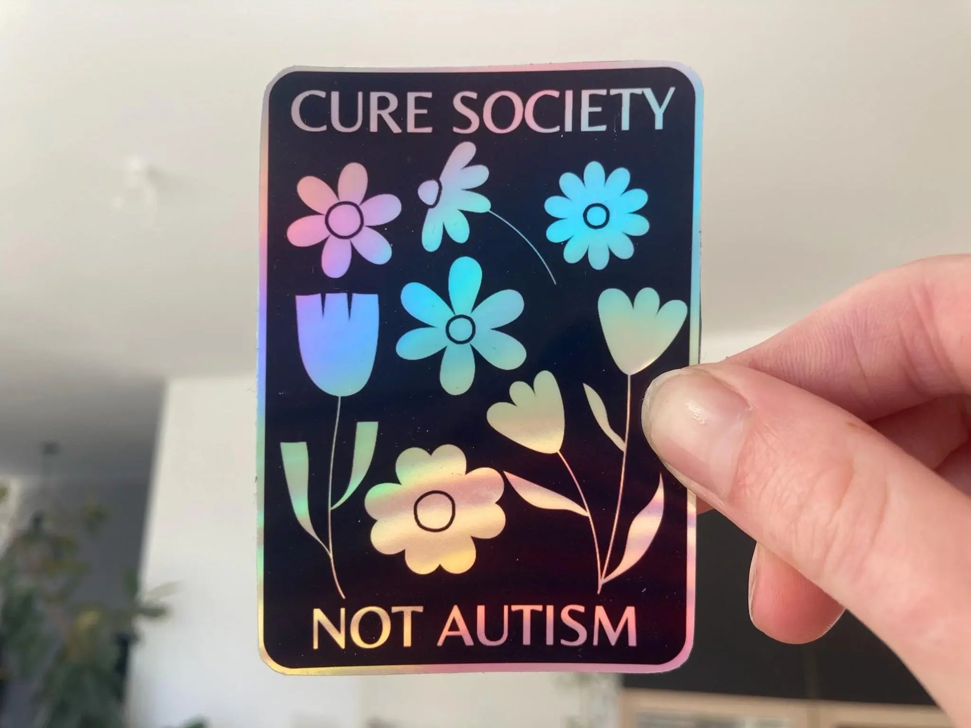 Flower "cure society not autism" holographic sticker - Neurodiversetea