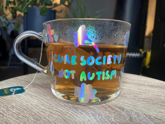 "Cure society, not autism" mug - Neurodiversetea