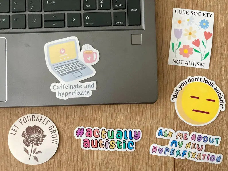 Caffeinate and hyperfixate ADHD sticker shown as laptop sticker, handmade by Neurodiversetea