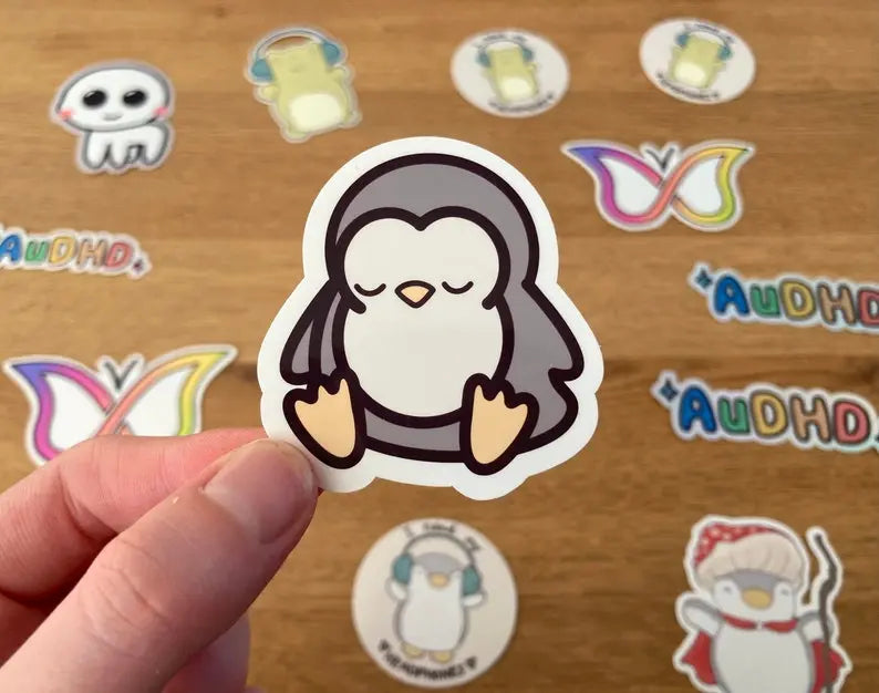 "Wired but tired" sleepy penguin sticker without text, handmade by small business Neurodiversetea