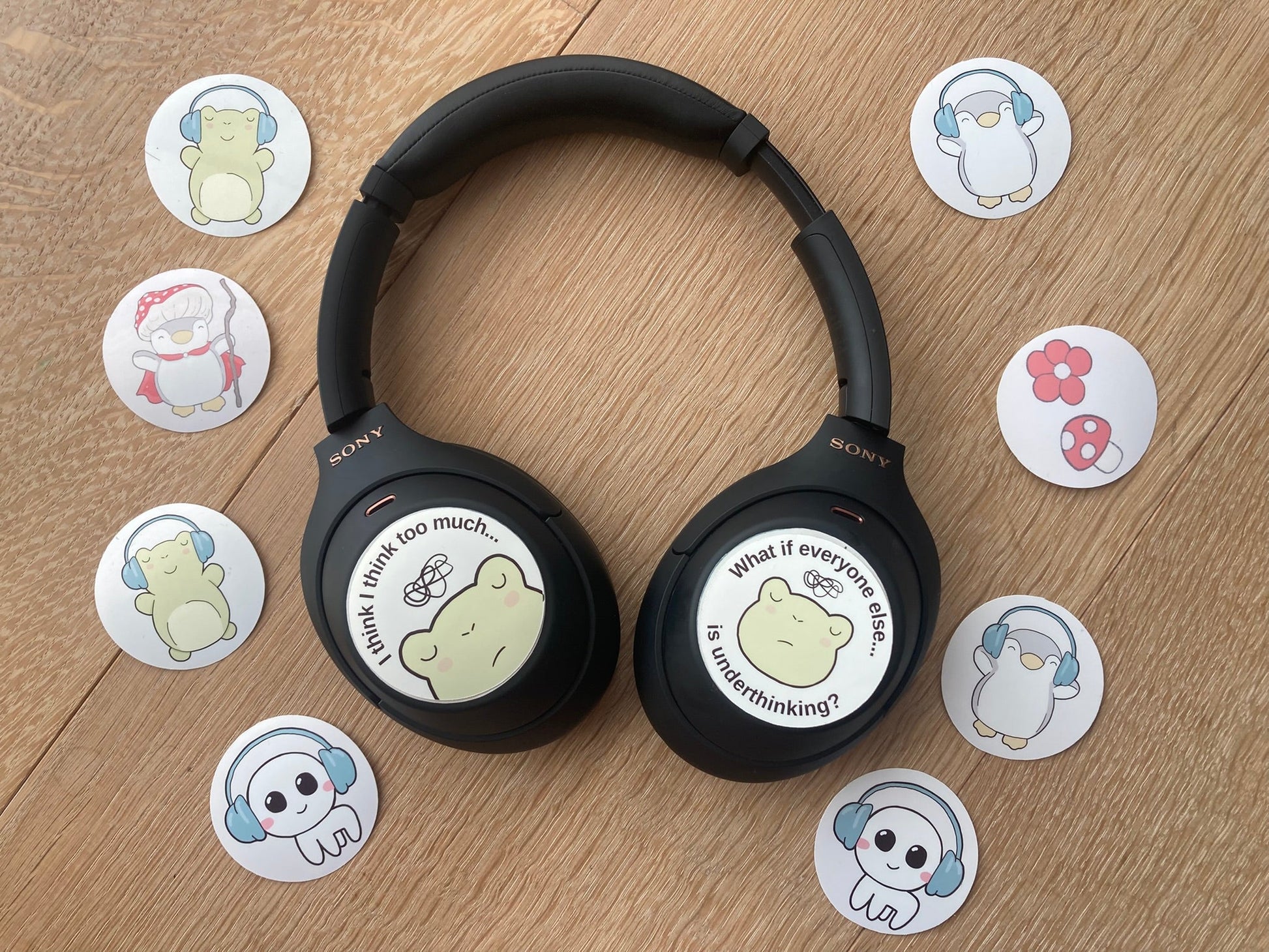 Headphone sticker set: overthinking frog with the text "I think too much": and "What if everyone else is underthinking". 