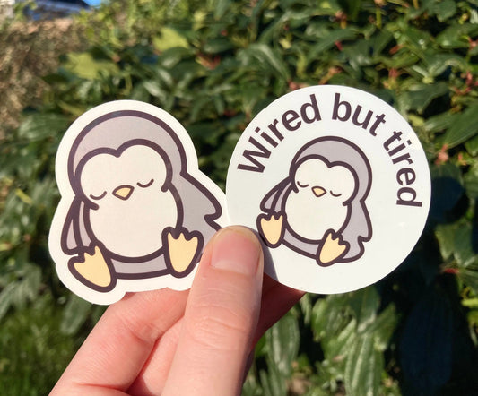 "Wired but tired" sleepy penguin sticker, handmade by NeurodiversTea (small business) 